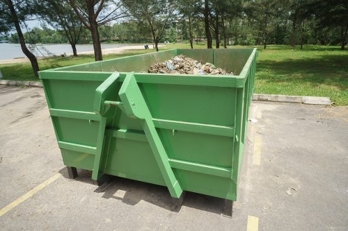 Colour-coded skips for garden waste, recyclables and general rubbish